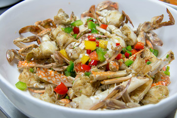 crab stir fried with pepper in white bowl