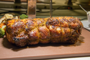 roasted pork on station in dining room