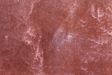 Fototapeta premium Old painted metal surface. Rusty metal, peeling paint, red tones. Worn metallic iron panel.