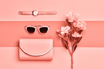Fashion Woman Accessories Set. Pastel Coral Color. Flat lay. Trendy Handbag Clutch, Glamour coral Sunglasses. Flower. Art Design. Minimal fashionable Style