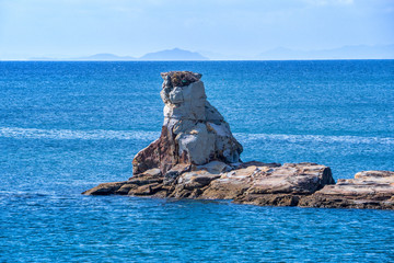 Many small islands over the blue ocean in sunny day, famous Kujukushima(99 islands) pearl sea resort islet in Sasebo Saikai National Park, Nagasaki, Kyushu, Japan.
