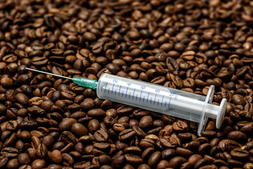 Coffee grains background, spritz. Coffee is like a drug. Coffee is life threatening. Dangerous drug