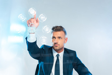 handsome businessman pointing on icons isolated on white, artificial intelligence concept
