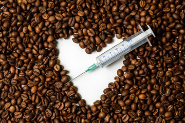 Coffee grains background, spritz. Coffee is like a drug. Coffee is life threatening. Dangerous drug.