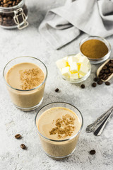 Keto bulletproof coffee in glasses. Selective focus, space for text.