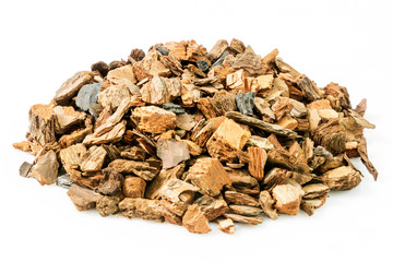 Tree, pine bark with charcoal used for orchid gardening on a white background.