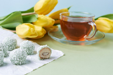 coconut candies and cup of tea