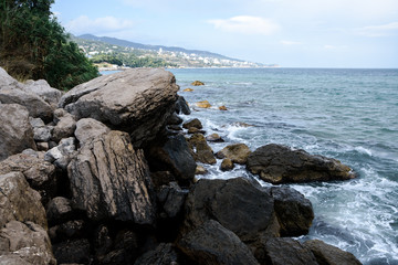 Fototapeta na wymiar Sea waves, beating on the stones. Noisy sea. Coast of the Black Sea