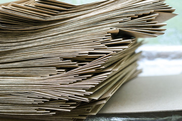 Side View Of Huge Stack of Recycled Paper close up. Business concept. Huge Stack of Recycled Paper envelopes closeup. 