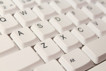 White computer keyboard. Close-up. Background. Texture.