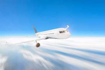 Fototapeta na wymiar Passenger airliner flies in the sky above the clouds, journey airplane
