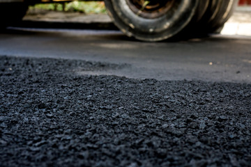Laying of new asphalt. The new road. Road repair street.
