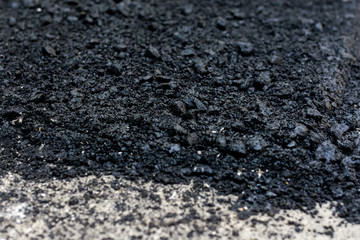 Laying of new asphalt. The new road. Road repair street.