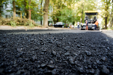 Laying of new asphalt. The new road. Road repair street.