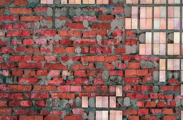 Background from old cracked bricks with shabby tiles