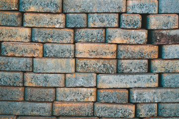 background of stacked paving tiles with a rough texture