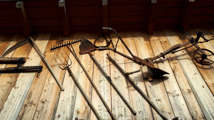 old farmer tools on a wooden background