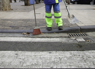 Sweeper cleaning street