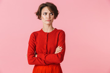 Portrait of a beautiful young woman wearing red clothes - obrazy, fototapety, plakaty