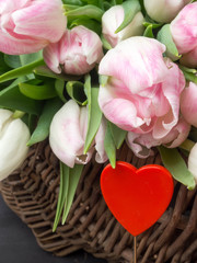 Spring decoration, tulips in a basket blurred, soft mist, postcard
