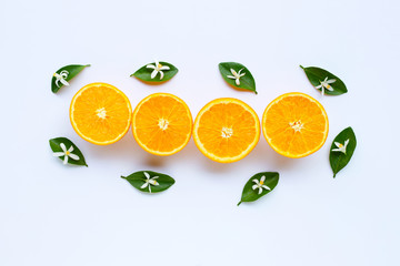 High vitamin C. Fresh orange citrus fruit with leaves isolated on white.