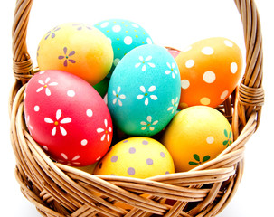 Perfect colorful handmade easter eggs in the basket isolated