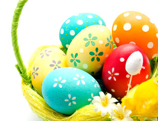 Perfect colorful handmade easter eggs in the basket isolated