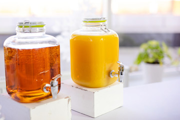 Fresh orange juice in the mason jar on wood table