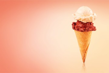 Tasty ,sweet Ice Cream  in the cone on background