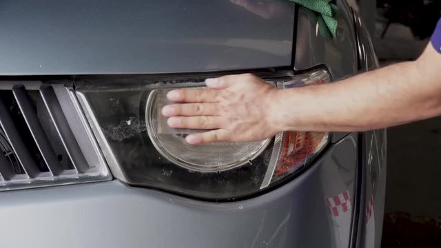 Big headlight cleaning with power buffer machine at service station ,Before and after cleaning