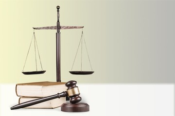 Justice Scales, gavel and books on light background