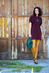 beautiful middle-aged brunette in burgundy dress