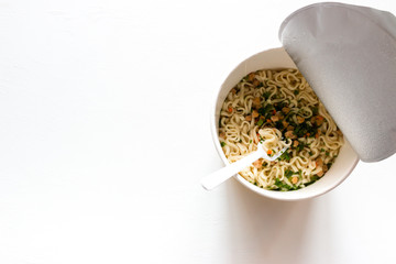 instant noodles on a white background with space for text