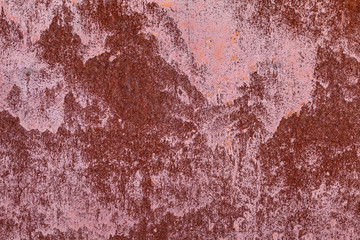 Old painted metal surface. Rusty metal, peeling paint, red tones. Worn metallic iron panel.