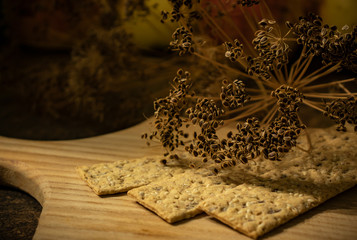 Toasts with sesame and herbs and dried dill close-up.