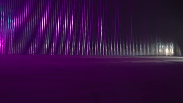 Silhouette of beautiful american muscle car on smoked dark background . Car lights on fog . 