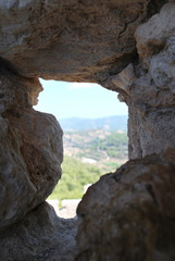 Close up of loopholes in the stone wall of the ruins of Kritinia Castle, Kritinia Village, Rhodes Island, Greece