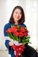 Woman giving a flower bouquet