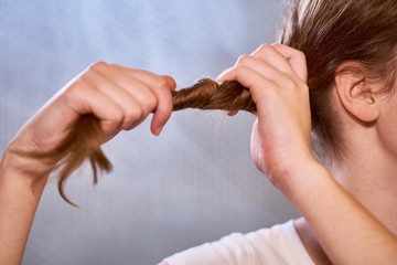 Woman making a hairstyle