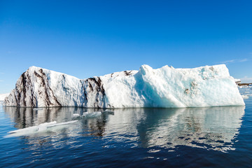 Fototapeta na wymiar panorama of icebergs floating in the blue lagoon