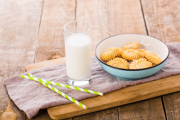 Glass of Milk with Straws and Cookies