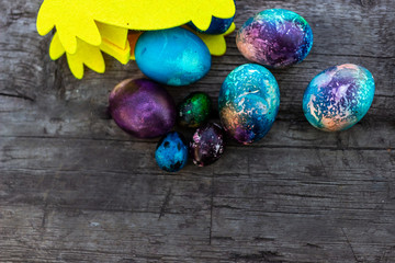chicken with Easter eggs on wooden background