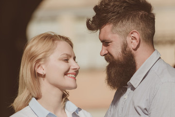 Happy to be in love. Couple in love on summer day. Loving couple of woman and hipster dating outdoor. Feeling love and romance. Sensual woman and bearded man enjoy romantic date