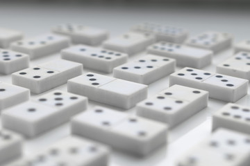 Domino pieces are neatly laid out on a white surface