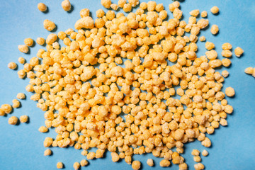 yellow granules on a blue background