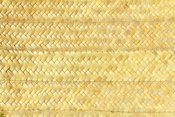 woven palm tree leaves or bamboo chips mat texture background