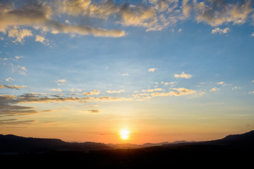 Fototapeta na wymiar Silhouette sunrise at mountains