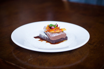 chocolate dessert with orange garnish