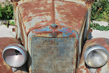 Close-up of front hood and headlights of an old rusty pickup truck, Rhodes Island, Greece