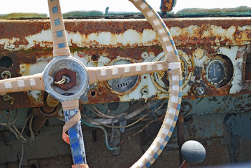 Close-up of the steering wheel and speedometer in the cabin of an old rusty pickup truck, Rhodes Island, Greece